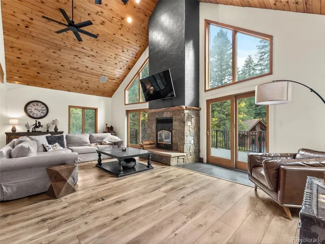 a living room with furniture fireplace and flat screen tv