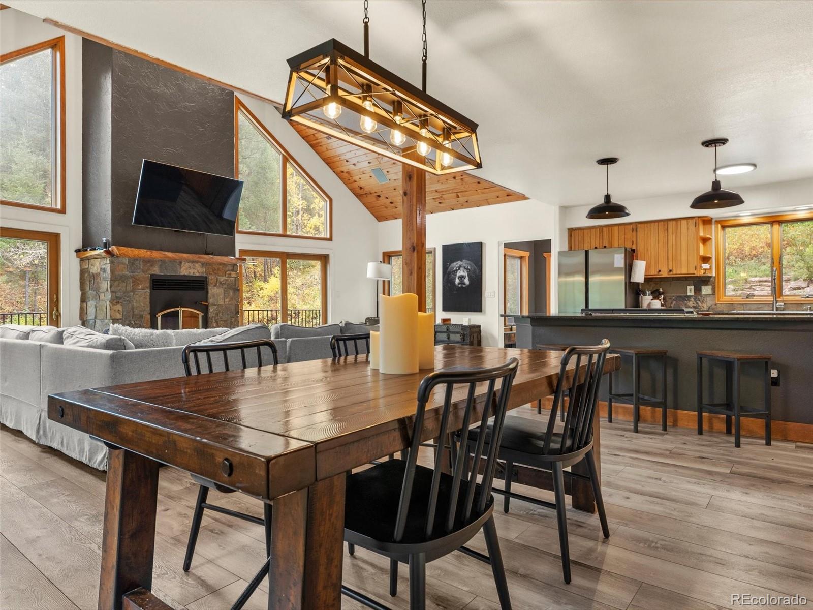 9459 South Turkey Creek Road Morrison, CO 80465 - Photo 8 of 25 a view of a dining room with furniture