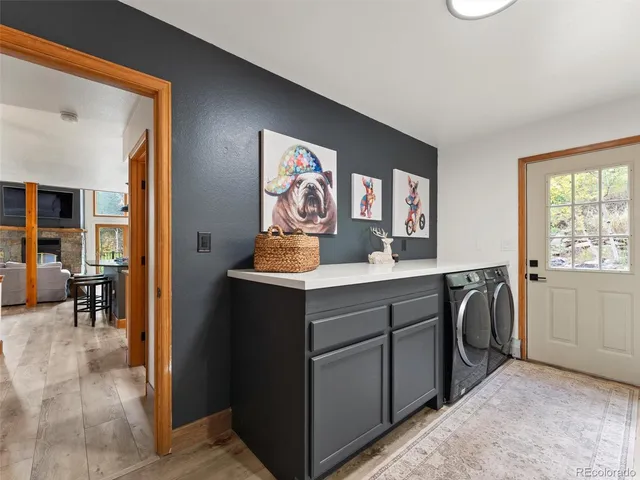 a view of cabinets a sink and a dishwasher in a room