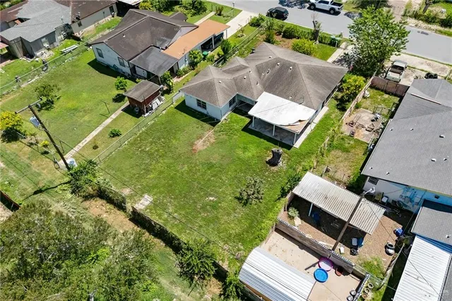 an aerial view of house with yard