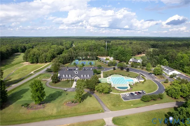 an aerial view of a house with a swimming pool