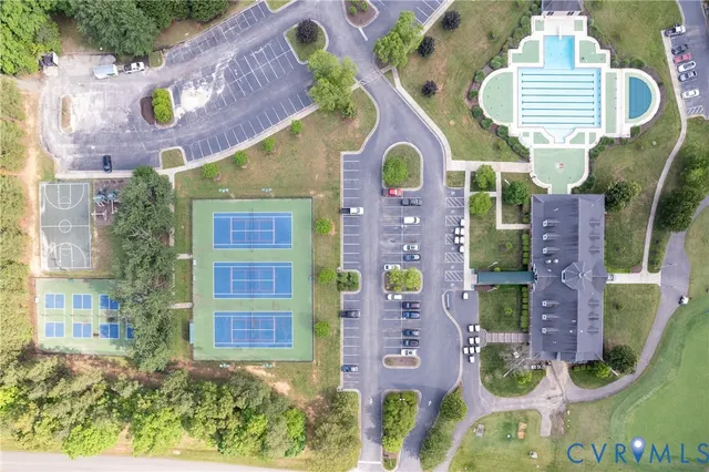 an aerial view of residential houses with outdoor space