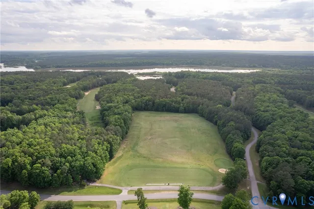 a view of a lake with green space