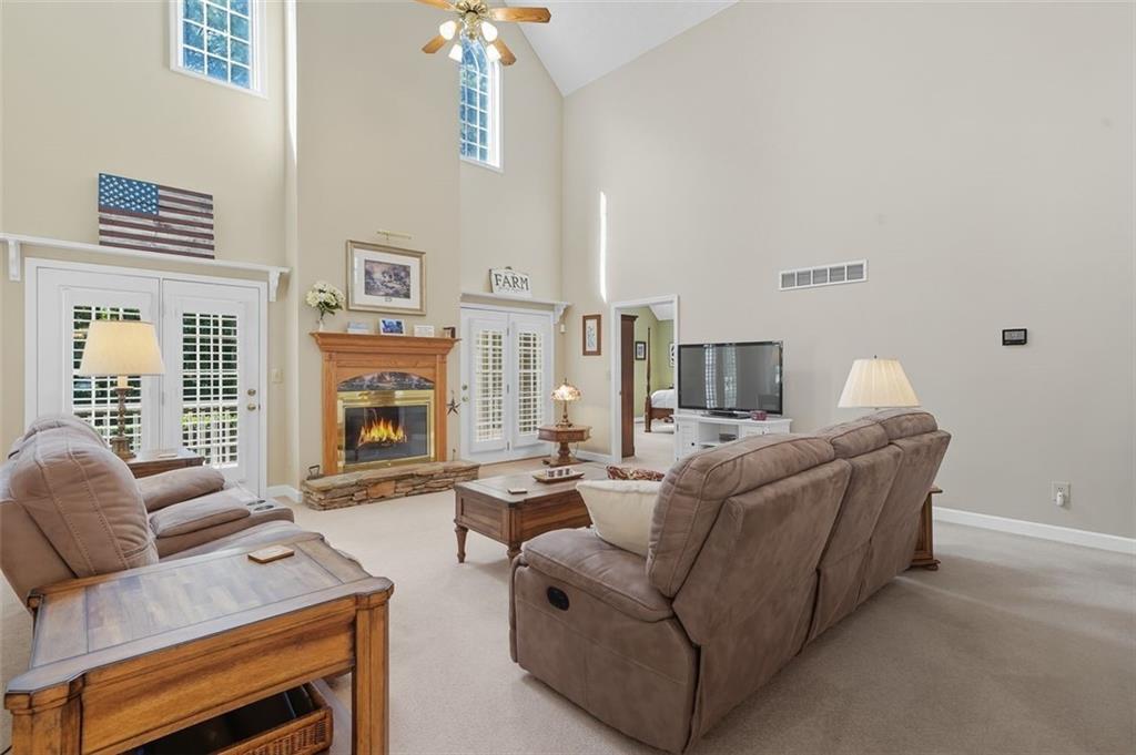 480 Pool Road Hiram, GA 30141 - Photo 21 of 45 a living room with furniture a fireplace and a flat screen tv