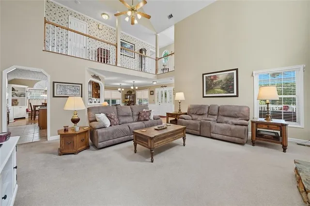a living room with furniture and a table