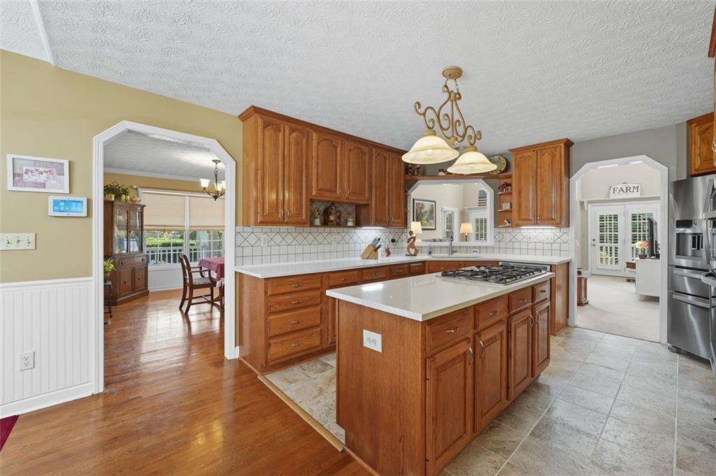 480 Pool Road Hiram, GA 30141 - Photo 25 of 45 a kitchen with stove a sink dishwasher and a stove with wooden floor