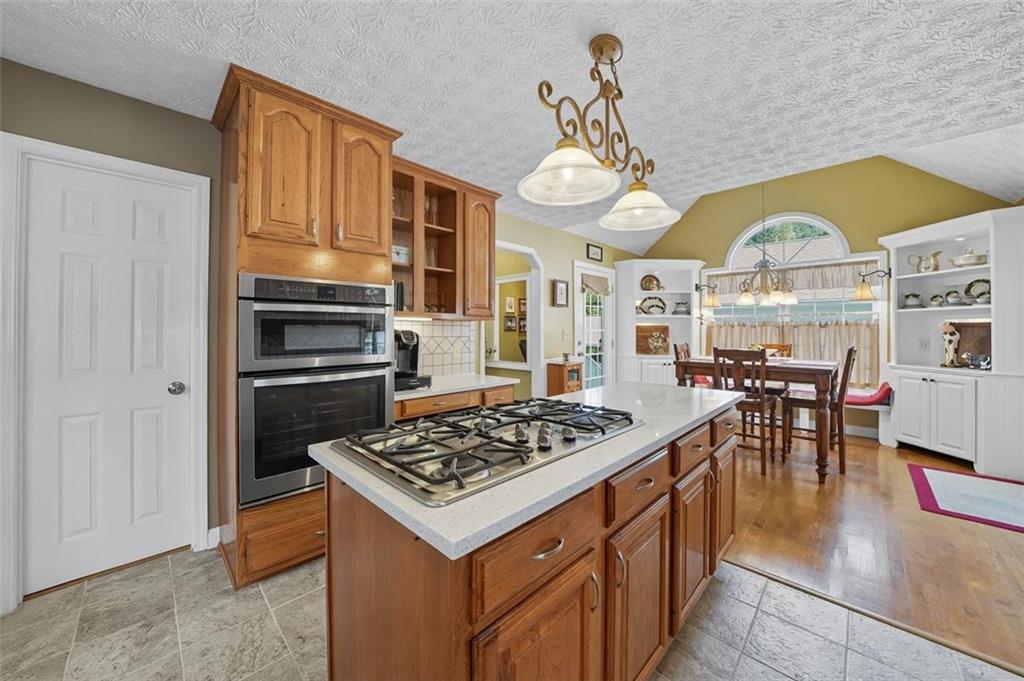 480 Pool Road Hiram, GA 30141 - Photo 26 of 45 a kitchen with a stove a table and chairs