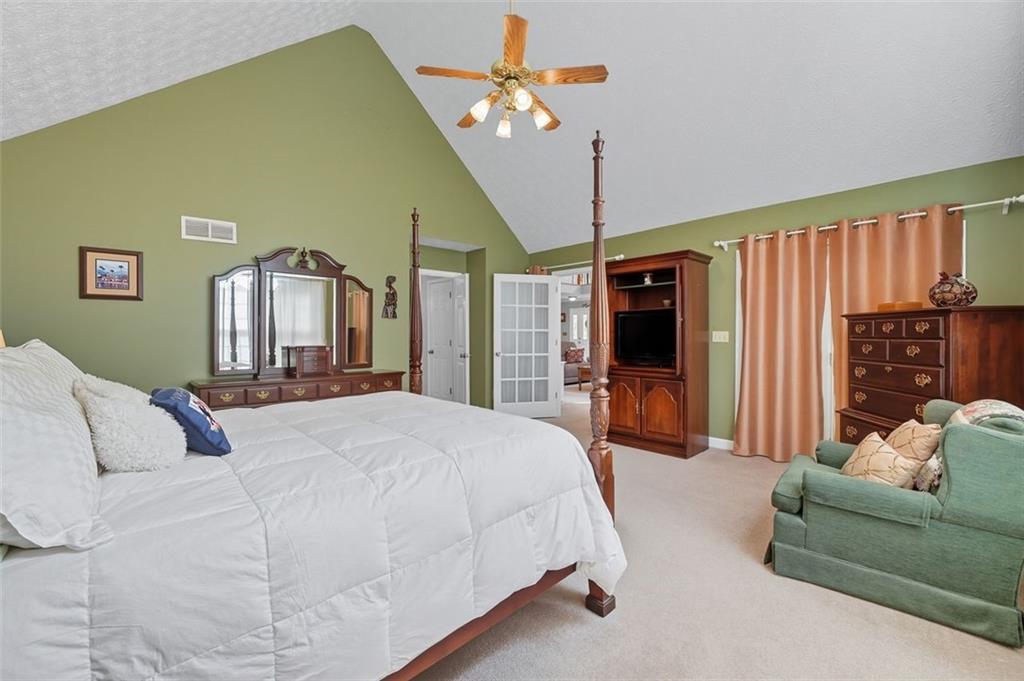 480 Pool Road Hiram, GA 30141 - Photo 31 of 45 a bedroom with a large bed couch and a window