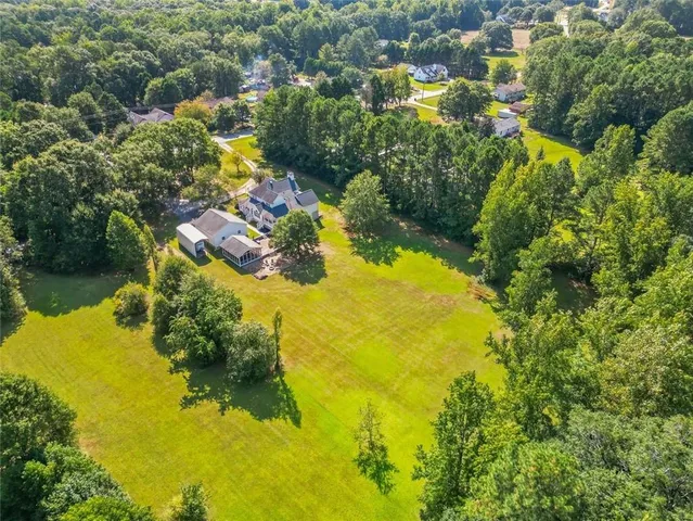 an aerial view of residential houses with swimming pool