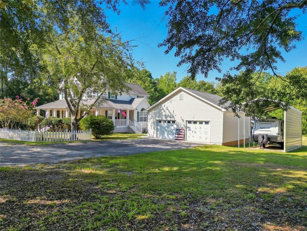 480 Pool Road Hiram, GA 30141 - Photo 6 of 45 a view of a house with a yard and large trees