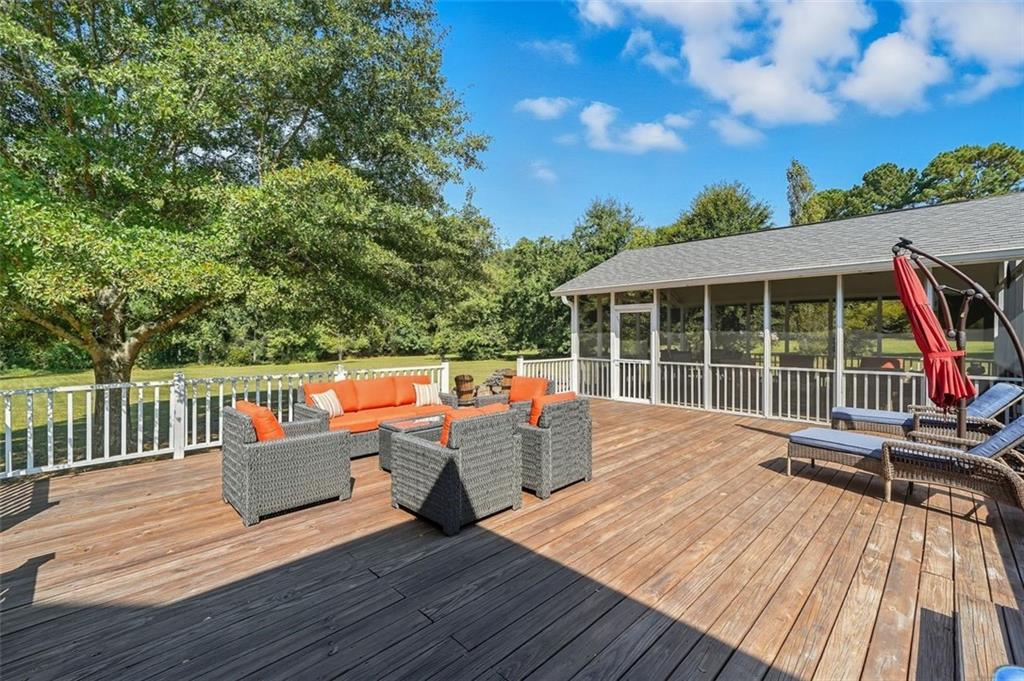 480 Pool Road Hiram, GA 30141 - Photo 9 of 45 a view of roof deck with wooden floor and fence