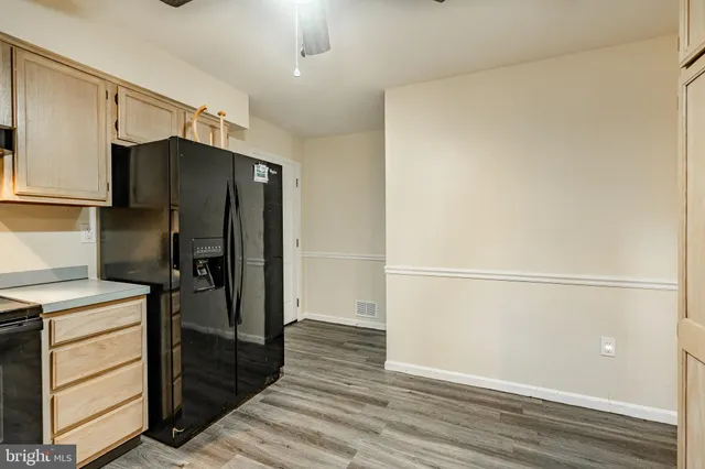 a view of storage and utility room in wooden floor