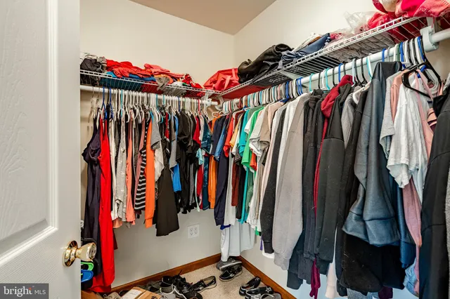 a side view of a house with wooden deck