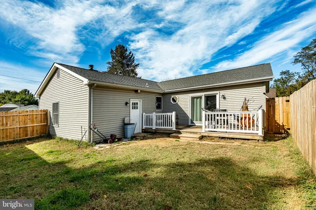 an aerial view of a residential houses with outdoor space