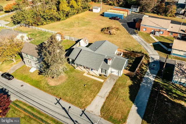 an aerial view of residential houses with outdoor space