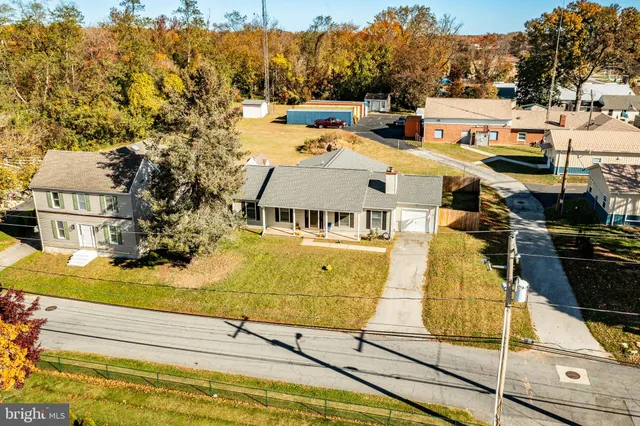 an aerial view of a house with a ocean view