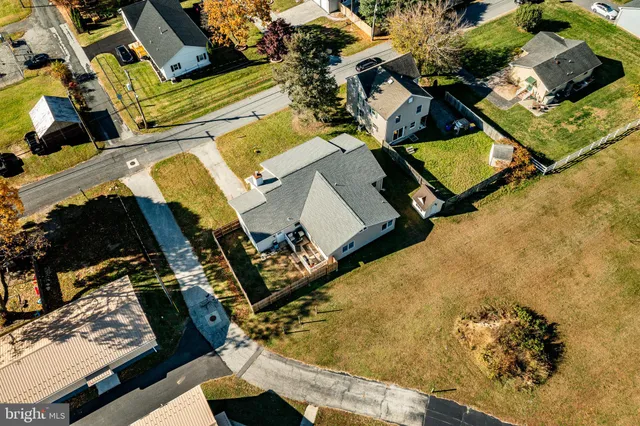 an aerial view of residential houses with outdoor space