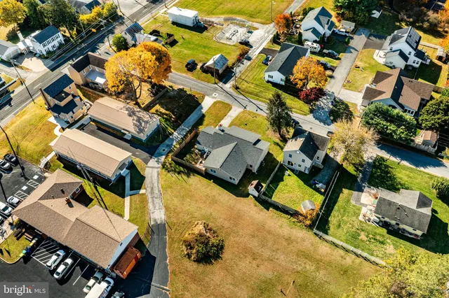 an aerial view of a house with a garden