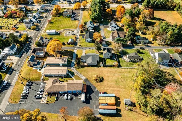an aerial view of a house with a swimming pool