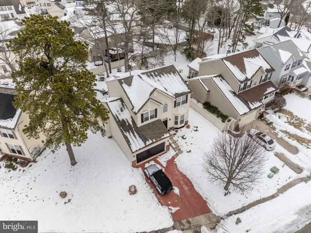 a view of a house with a backyard and a patio