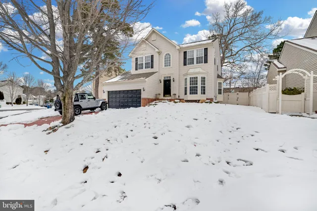 a kitchen with stainless steel appliances granite countertop a refrigerator and a stove