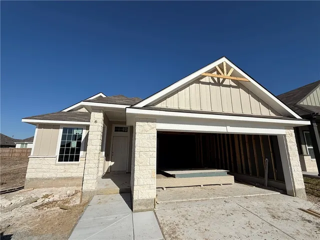 a view of an empty room with windows
