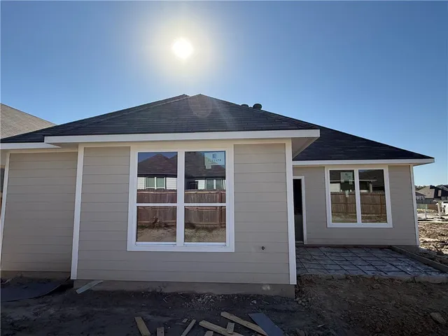 a bathroom with a tub a sink and a shower