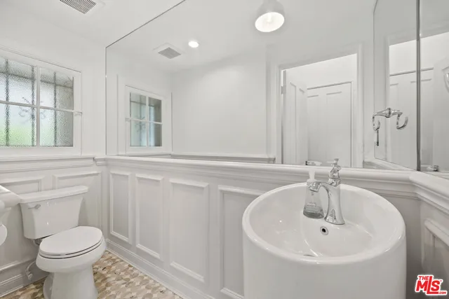 a bathroom with a sink and a toilet