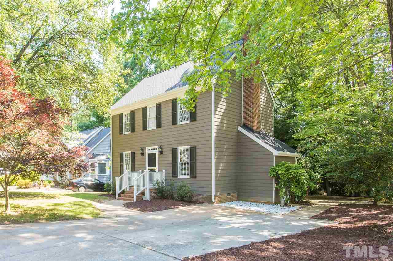 4513 Lancashire Drive Raleigh, NC 27613 - Photo 2 of 25 a front view of a house with a yard and garage