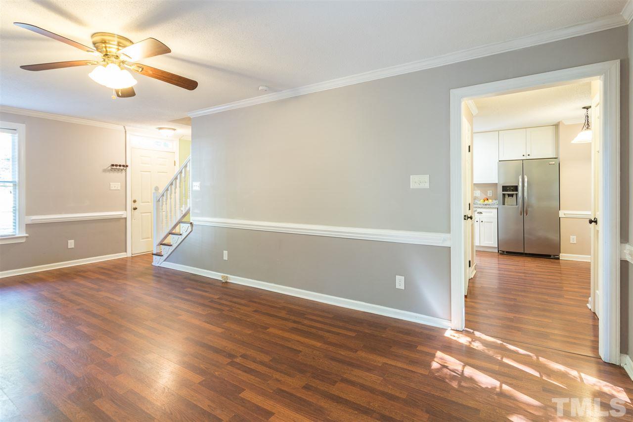4513 Lancashire Drive Raleigh, NC 27613 - Photo 13 of 25 wooden floor in an empty room with a window