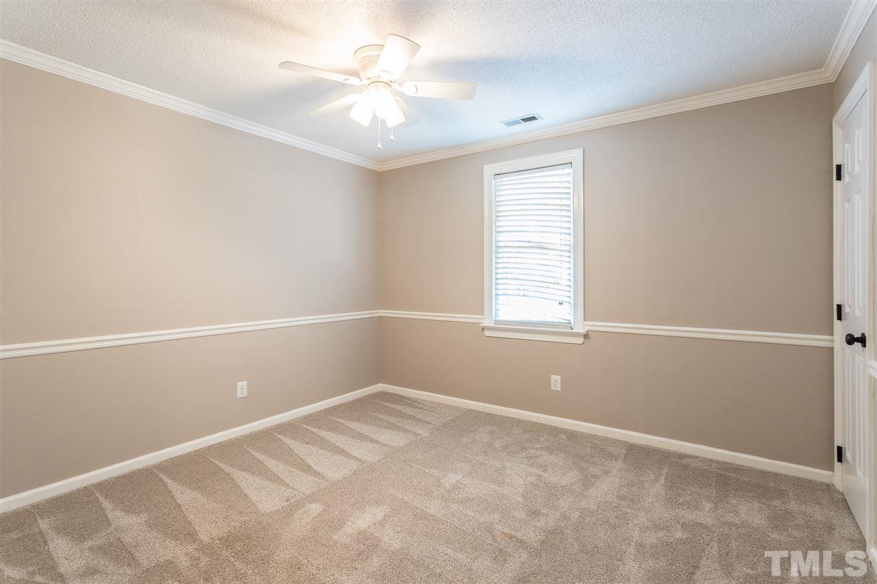 4513 Lancashire Drive Raleigh, NC 27613 - Photo 19 of 25 a view of an empty room with a window