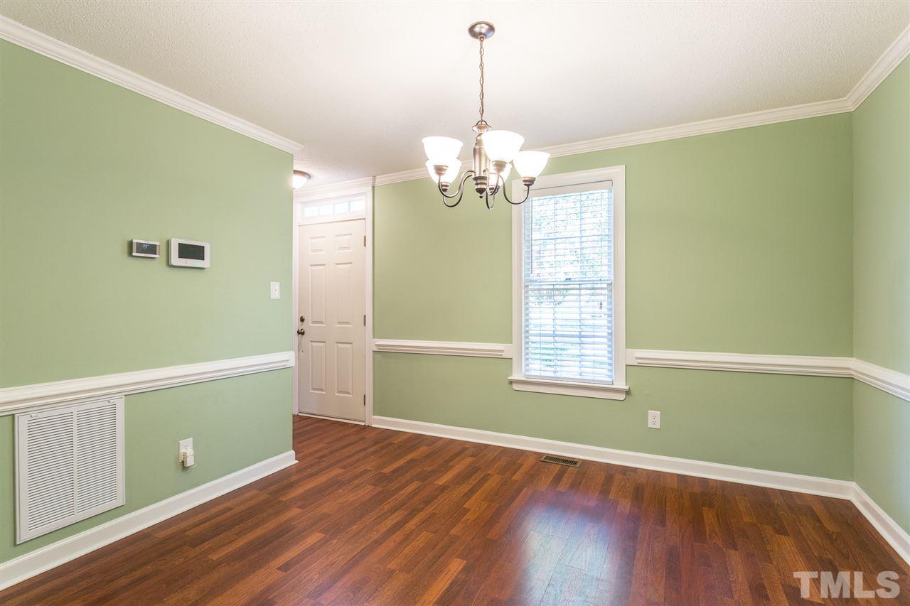 4513 Lancashire Drive Raleigh, NC 27613 - Photo 5 of 25 a view of a room with wooden floor and entryway