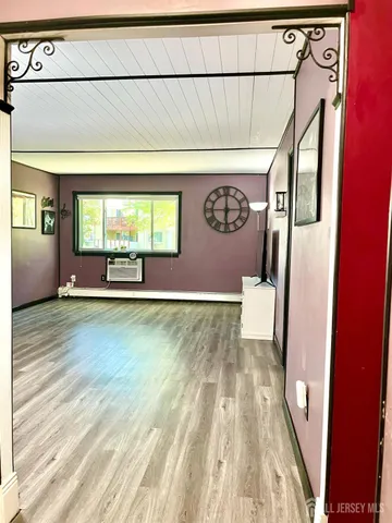 a view of outdoor space with wooden floor and windows