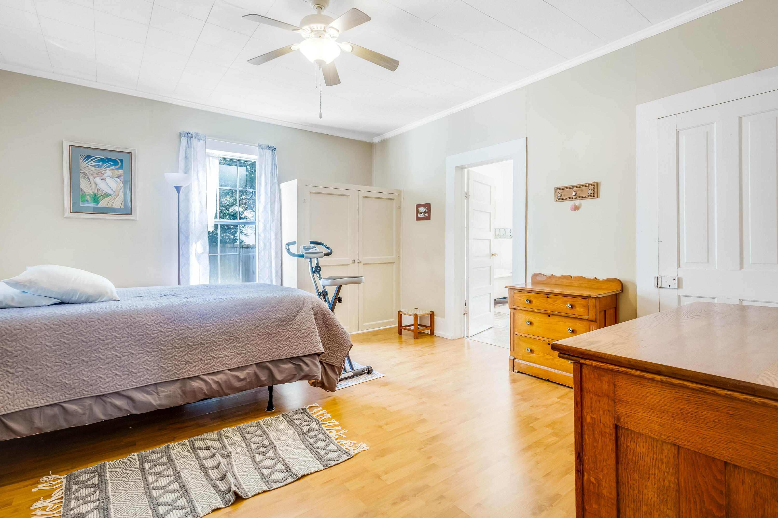 21132 Seminole Street Florala, AL 36455 - Photo 11 of 44 a bedroom with a bed and wooden floor