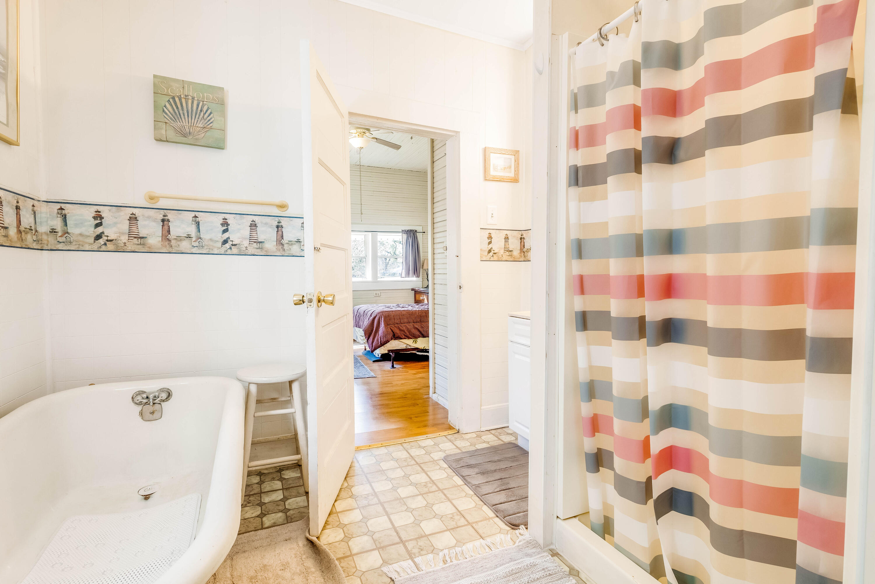 21132 Seminole Street Florala, AL 36455 - Photo 15 of 44 a bathroom with a bathtub and shower