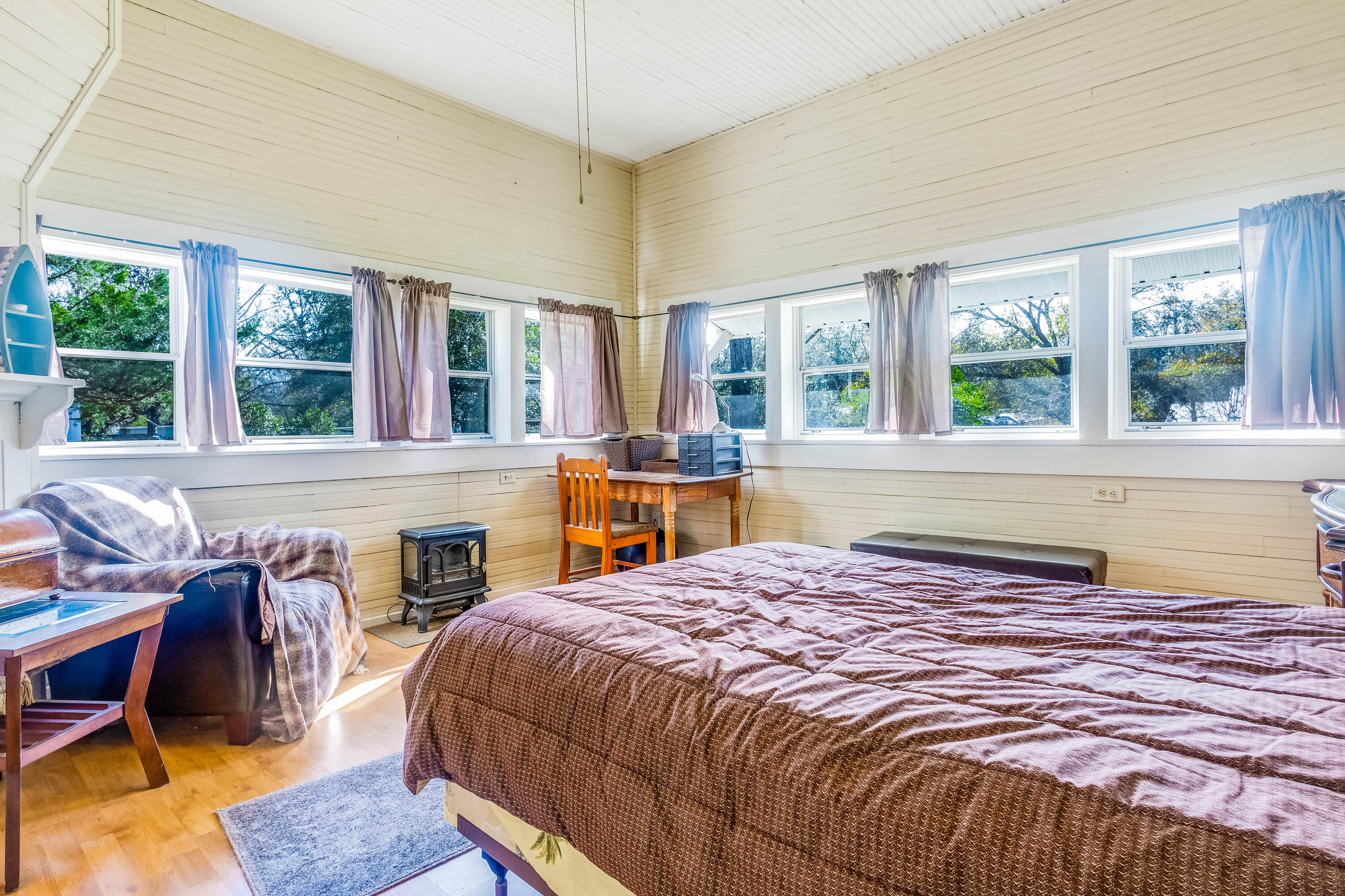 21132 Seminole Street Florala, AL 36455 - Photo 17 of 44 a spacious bedroom with a bed and a large window