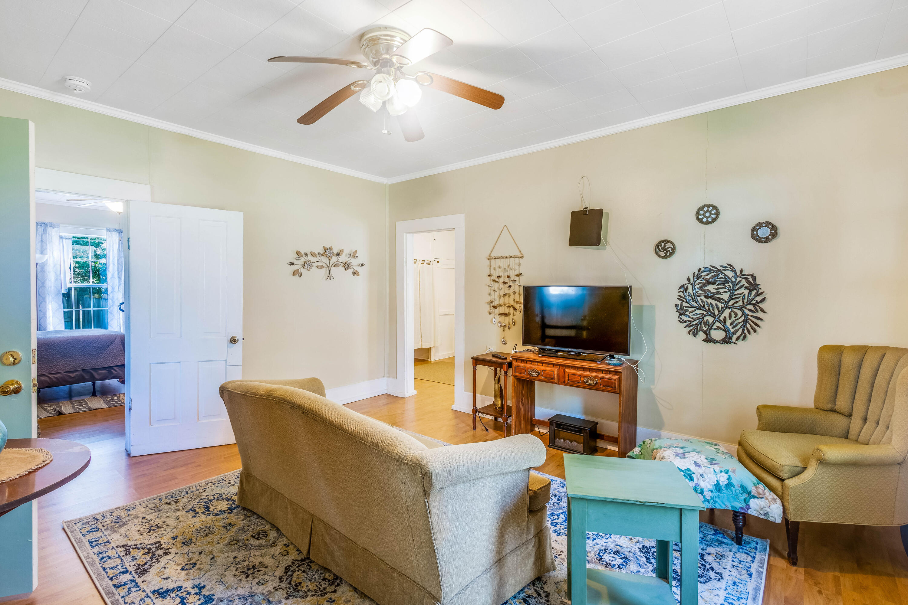 21132 Seminole Street Florala, AL 36455 - Photo 32 of 44 a living room with furniture and a flat screen tv