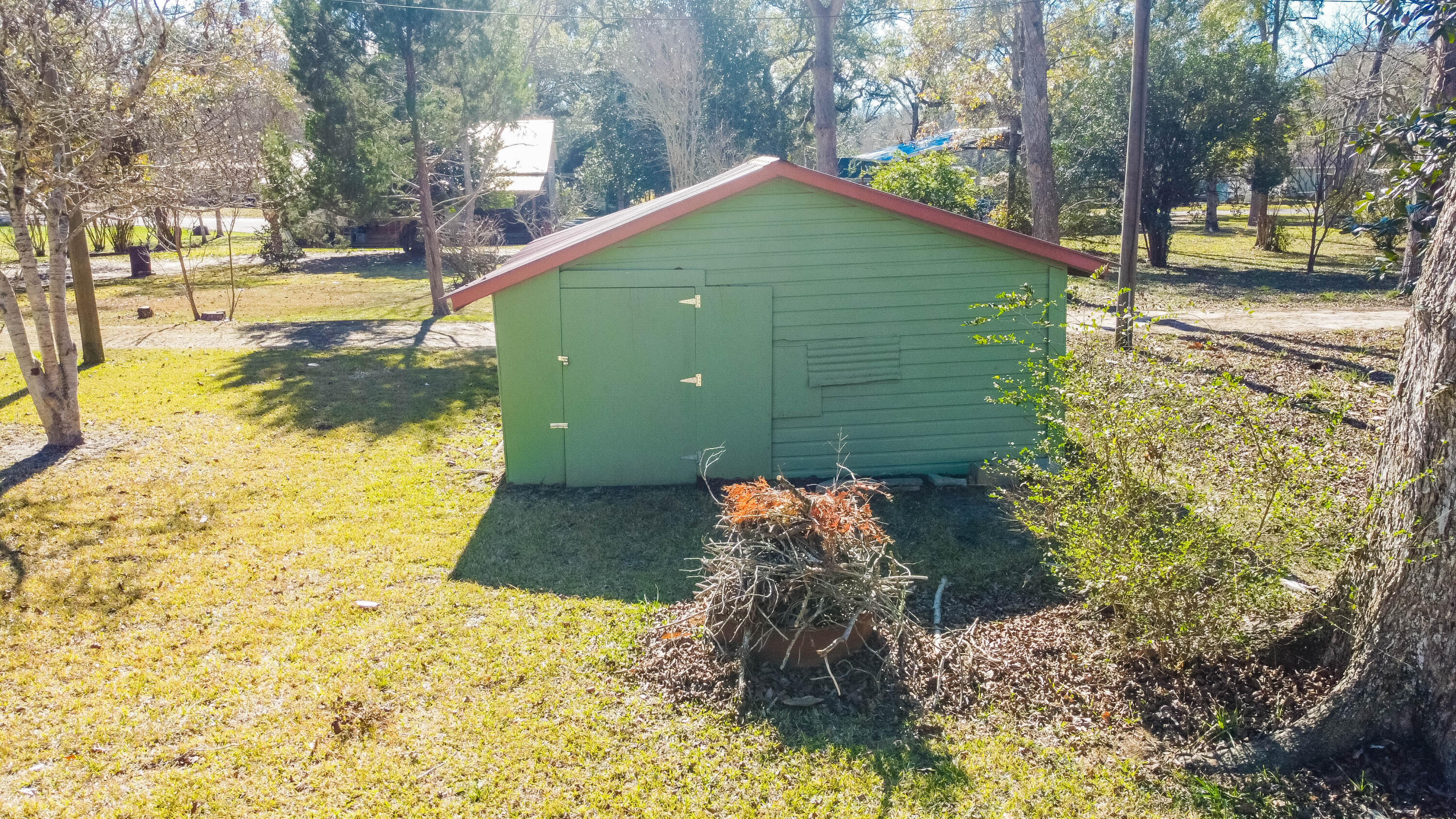 21132 Seminole Street Florala, AL 36455 - Photo 5 of 44 a backyard of a house with a yard and outdoor seating