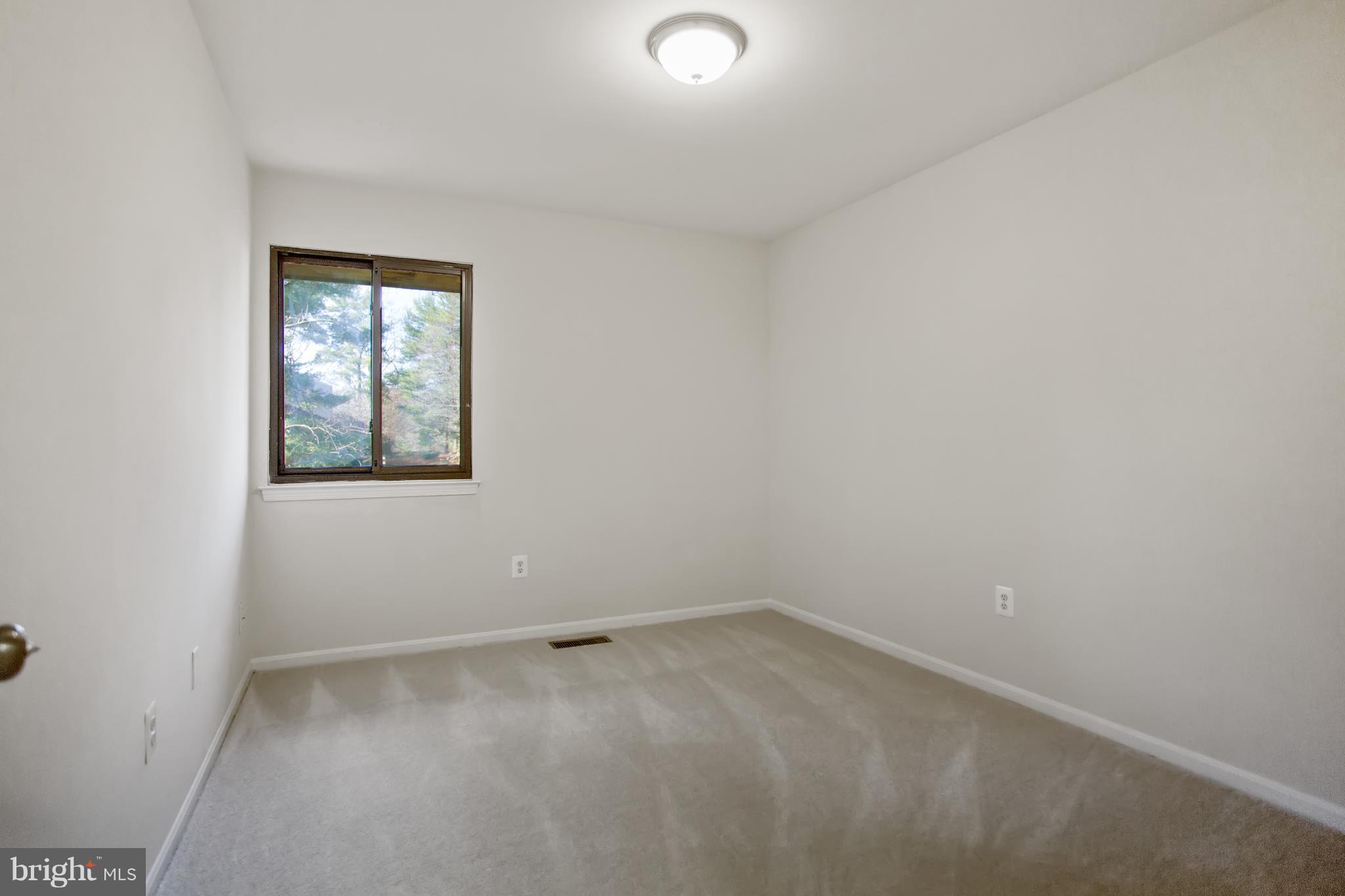 11106 Saffold Way Reston, VA 20190 - Photo 22 of 29 an empty room with a window