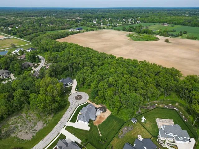 an aerial view of lake residential house and outdoor space