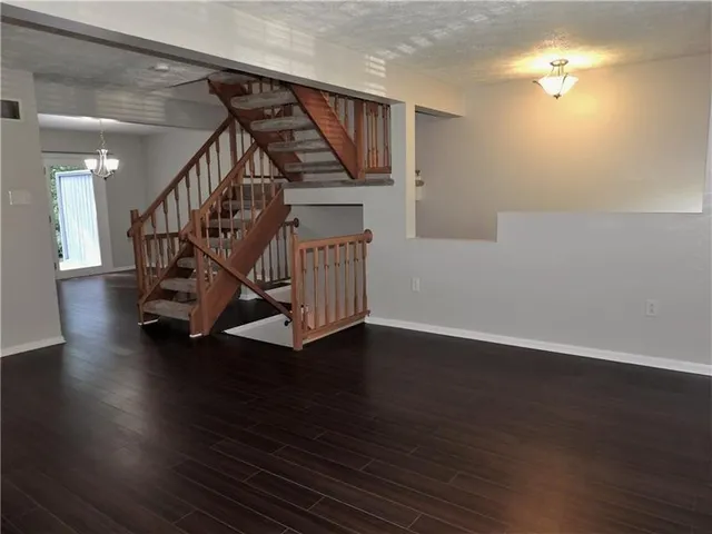 a view of entryway with wooden floor