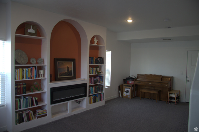 327 West Main Street, Unit 14 Santaquin, UT 84655 - Photo 4 of 20 Sitting room with built in features and dark colored carpet