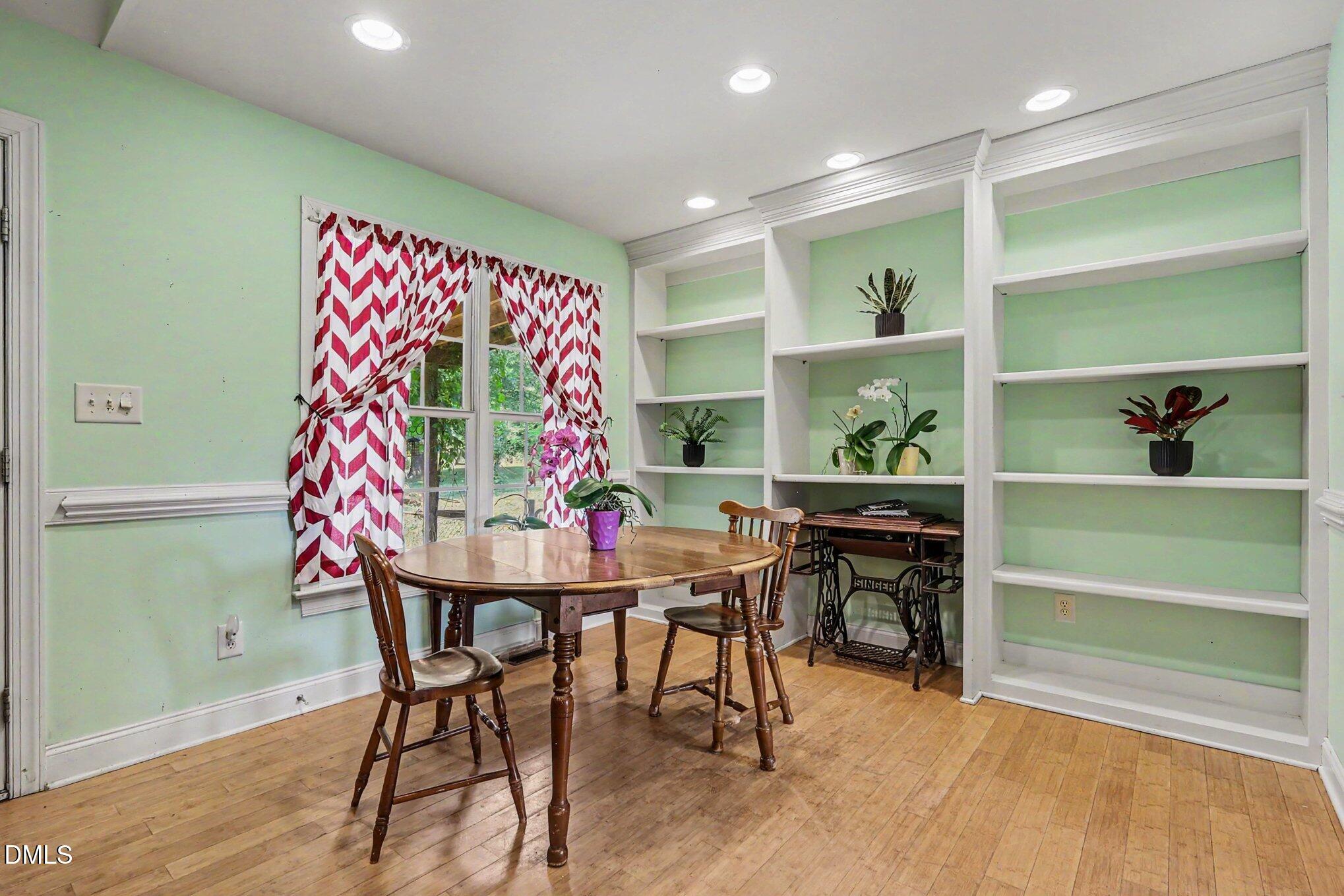 1750 Tom Oakley Road Timberlake, NC 27583 - Photo 8 of 31 a view of a dining room with furniture window and wooden floor