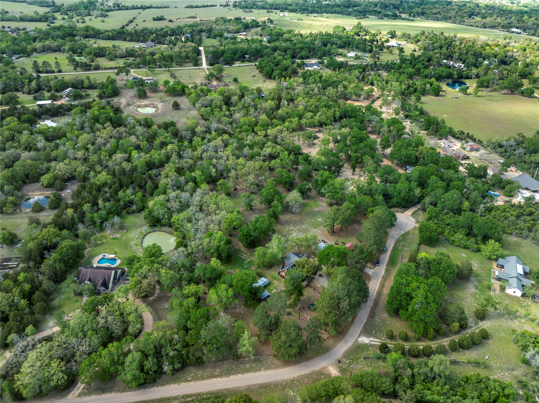 636 Deer Run Road Bellville, TX 77418 - Photo 22 of 23 an aerial view of residential house with outdoor space and trees all around