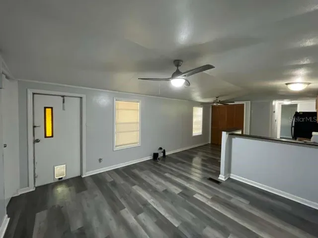 a view of an empty room and window