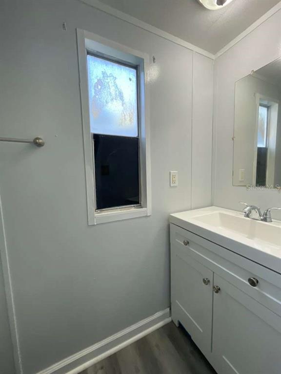 112 Mohawk Lane Altamonte Springs, FL 32714 - Photo 3 of 9 a bathroom with a sink and a mirror
