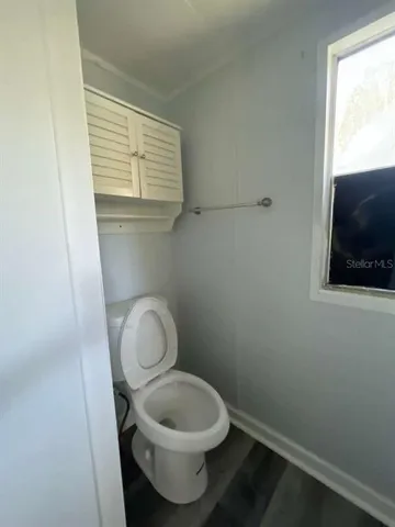 a bathroom with a toilet and a sink