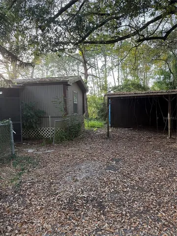 a backyard of a house with lots of green space