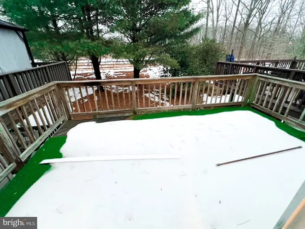 a view of a balcony with wooden floor