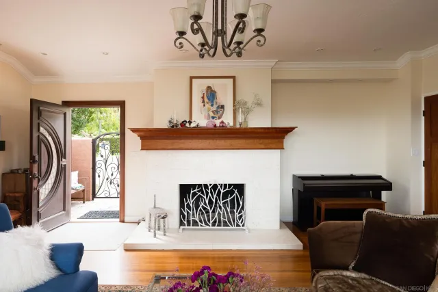 a living room with furniture and a fireplace